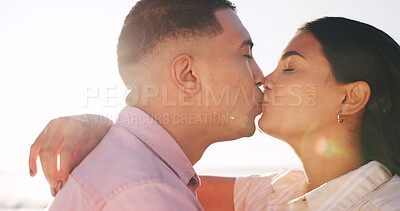 Buy stock photo Hug, kiss and travel with couple at beach for connection, romance and anniversary getaway. Marriage commitment, summer vacation and trust with man and woman outdoor for support, care and partner