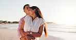 Hug, happy and kiss with couple at beach for connection, romance and anniversary getaway. Marriage commitment, summer vacation and trust with man and woman outdoor for support, care and partner