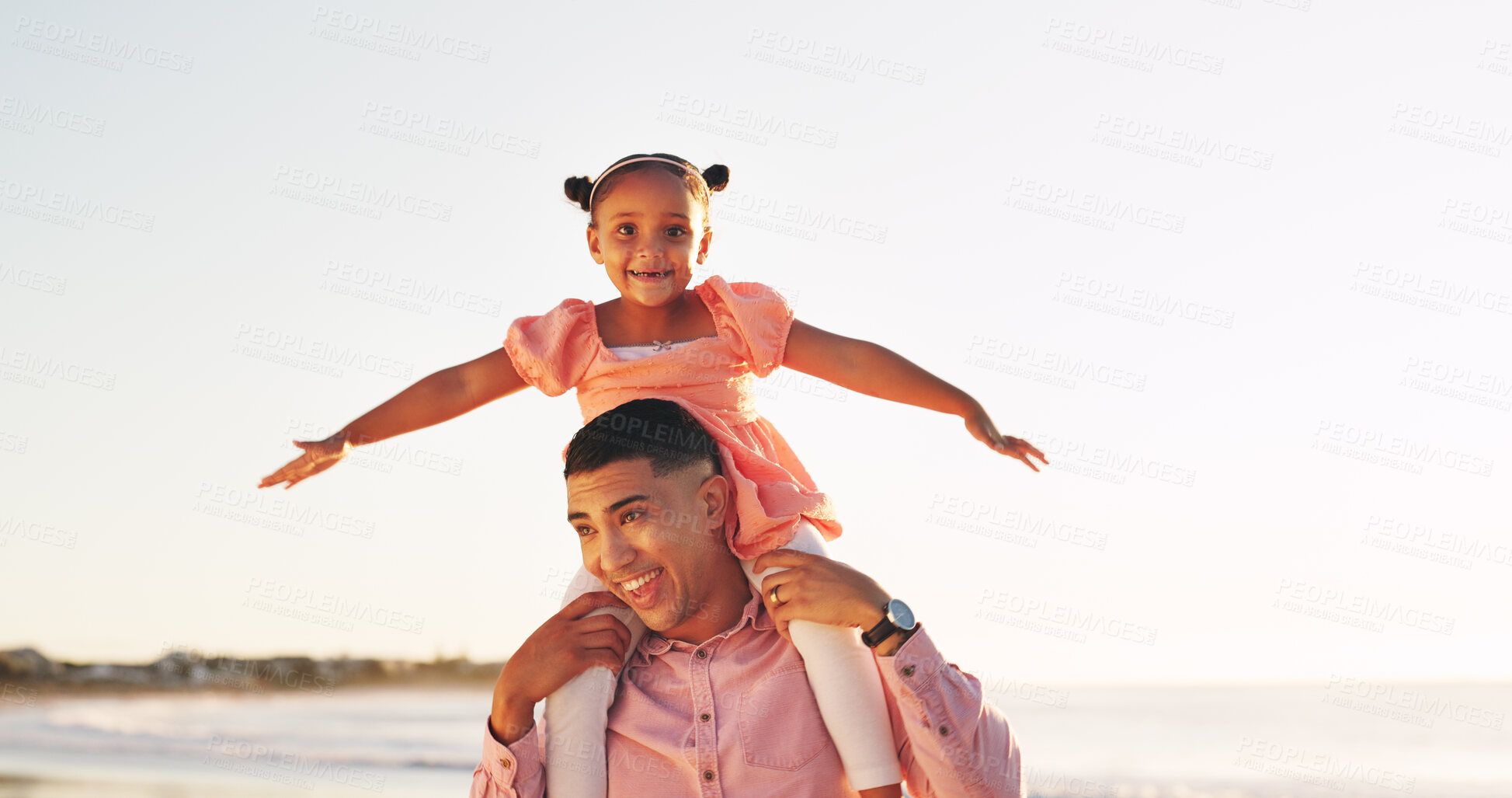 Buy stock photo Shoulder, freedom and father with daughter at beach for support, bonding and airplane game. Happiness, playful and summer vacation with man carrying child outdoor for travel, weekend break and love