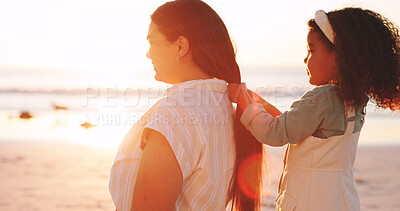 Buy stock photo Playing, hair and mom with child at beach for bonding on vacation, holiday and summer morning. Sunrise, travel and girl with hairstyle for mother by sea for relationship, connection and love outdoor