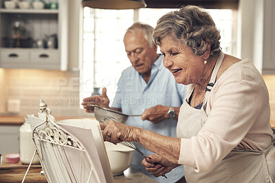 Buy stock photo Baking, reading and book with old couple in kitchen of home for love, bonding and cookies recipe. Ingredient list, support and cooking with senior man and woman in apartment for meal and food