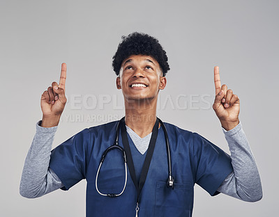 Buy stock photo Happy man, pointing and medical nurse in studio for advertising, solution or announcement. Up, male person and finger for marketing, promotion or insurance for surgery on white background or space