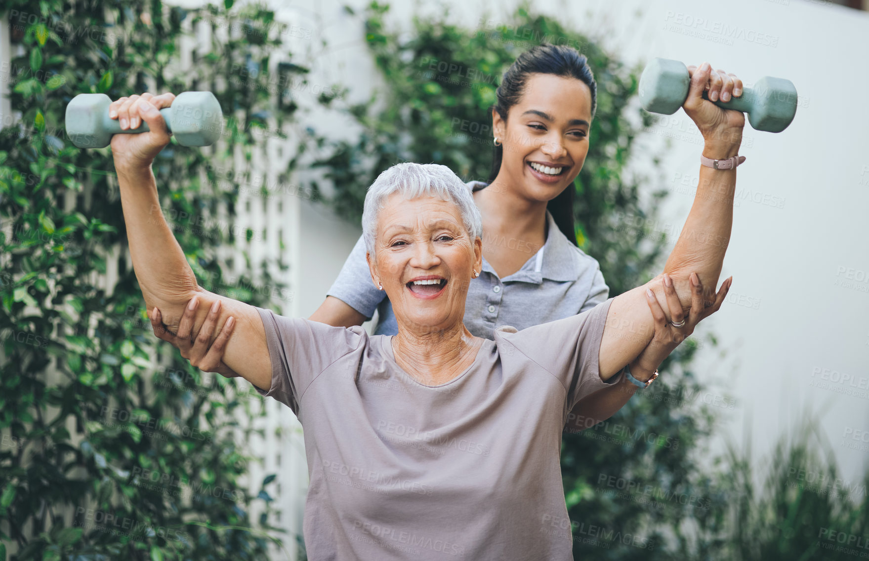 Buy stock photo Physiotherapist, weights and senior woman outdoor for healing, strength and consulting. Happy, physical therapist and elderly patient with dumbbell for arthritis, mobility exercise or support in home