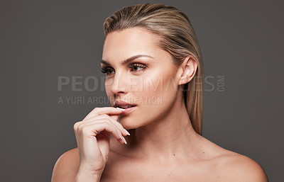 Buy stock photo Vision, woman and makeup for beauty in studio with serious, lash extension and facial makeover. Thinking, female person and cosmetics for transformation, eyelash volume and glamour on gray background
