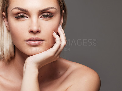 Buy stock photo Woman, beauty and touch with portrait in studio for natural makeup, glow and space on gray background. Person, serious and skincare with cosmetics, lipstick and pride with dermatology in Germany
