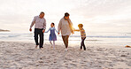 Happy, walking and grandparents with kids at beach for bonding, love and connection on holiday. Family, holiday hands and children with grandma and grandpa for relationship, relax and travel by sea