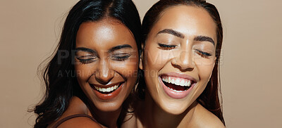 Buy stock photo Happy women, laughing and beauty with makeup for multiracial skin tone on a studio background. Interracial friends, female people or smile with glow up, shine or texture for cosmetics together