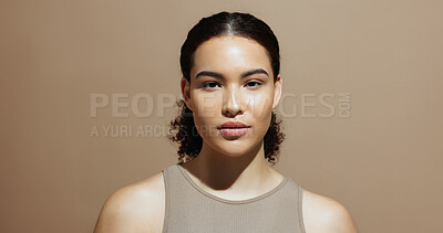 Buy stock photo Portrait, skincare and woman in studio, glow and natural dermatology on brown background space. Confidence, healthy skin and serious person with beauty cosmetics for shine, wellness and cosmetology