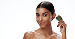 Portrait, woman and beauty in studio with gua sha, skincare routine or blood circulation benefits. Mockup space, person and smile for facial tool, inflammation relief or self care on white background