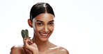 Portrait, woman and skincare in studio with gua sha, beauty routine or blood circulation benefits. Mockup space, female person and smile for massage tool, cosmetics or dermatology on white background