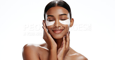 Buy stock photo Happy, woman and eye mask in studio with skincare, hyaluronic acid and reduction of dark circles. Person, collagen patch or product for beauty routine, hydration benefits or space on white background