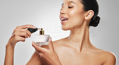 Buy stock photo Body care, woman and happy with perfume in studio for beauty, fresh scent and aesthetic product. Grooming, girl and smile with cosmetics on white background for luxury fragrance, selfcare or wellness