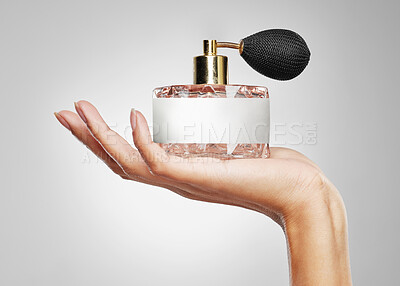 Buy stock photo Cosmetics, hands and woman with perfume marketing for beauty, luxury brand or aesthetic product. Grooming, girl and advertising fragrance bottle on white background for body care, hygiene or wellness