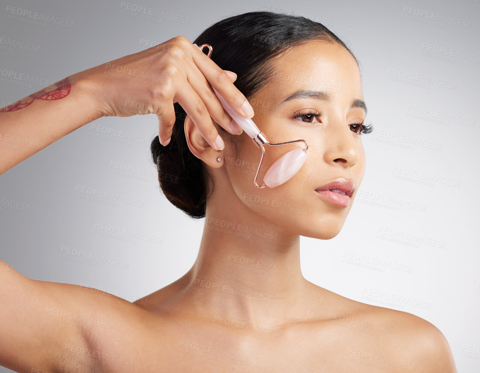 Buy stock photo Skincare, sculpt or woman in studio with roller, jaw contour or massage in facial routine. Wellness, skin lift or person with tool, lymphatic drainage or irritation reduction on white background.