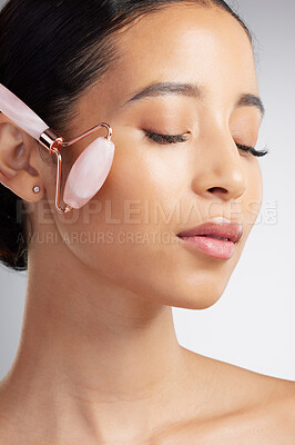 Buy stock photo Skincare, facelift or woman in studio with roller, jaw contour or massage in facial routine. Wellness, sculpting or person with tool, lymphatic drainage or irritation reduction on white background.