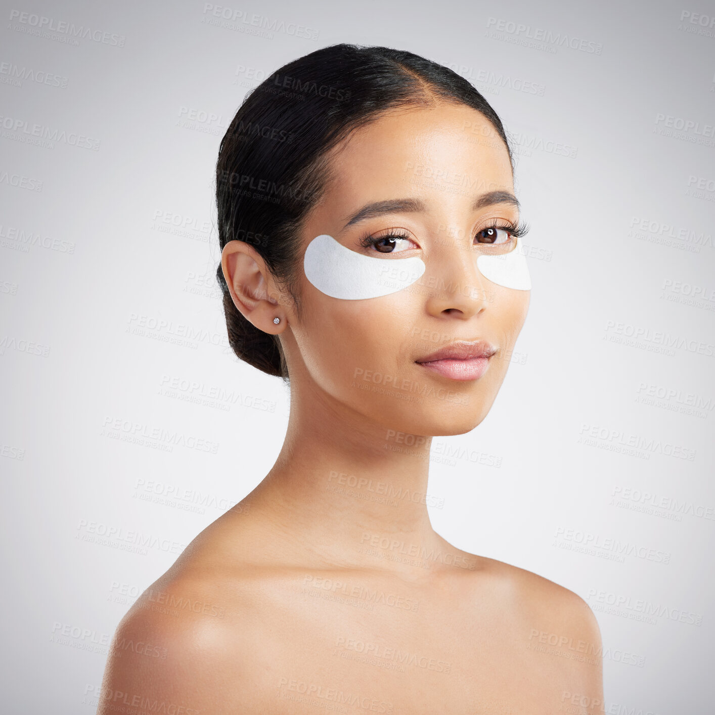 Buy stock photo Studio, skincare and woman with eye mask for dermatology, hyaluronic acid or skin hydration. Cosmetic, person or portrait with collagen patches for beauty, treatment or benefits on white background