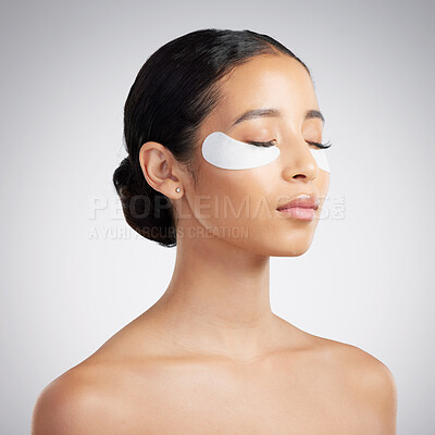 Buy stock photo Studio, skincare and woman with eye patches for dermatology, hyaluronic acid or skin hydration. Cosmetic, person or collagen pad for beauty, facial treatment or vitamin c benefits on white background