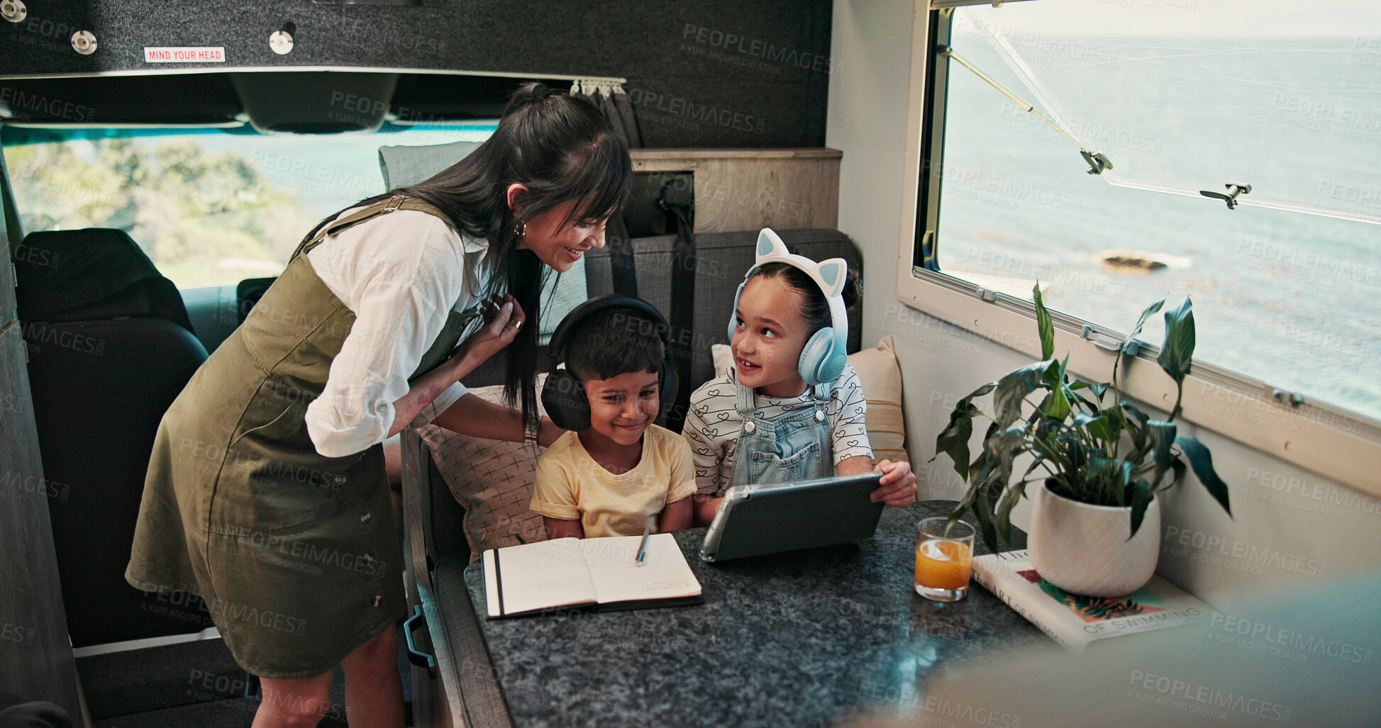 Buy stock photo Tablet, mother and children with headphones in caravan, elearning and educational video on family trip. Transport, happy woman or kids with tech for homework project, knowledge development or helping