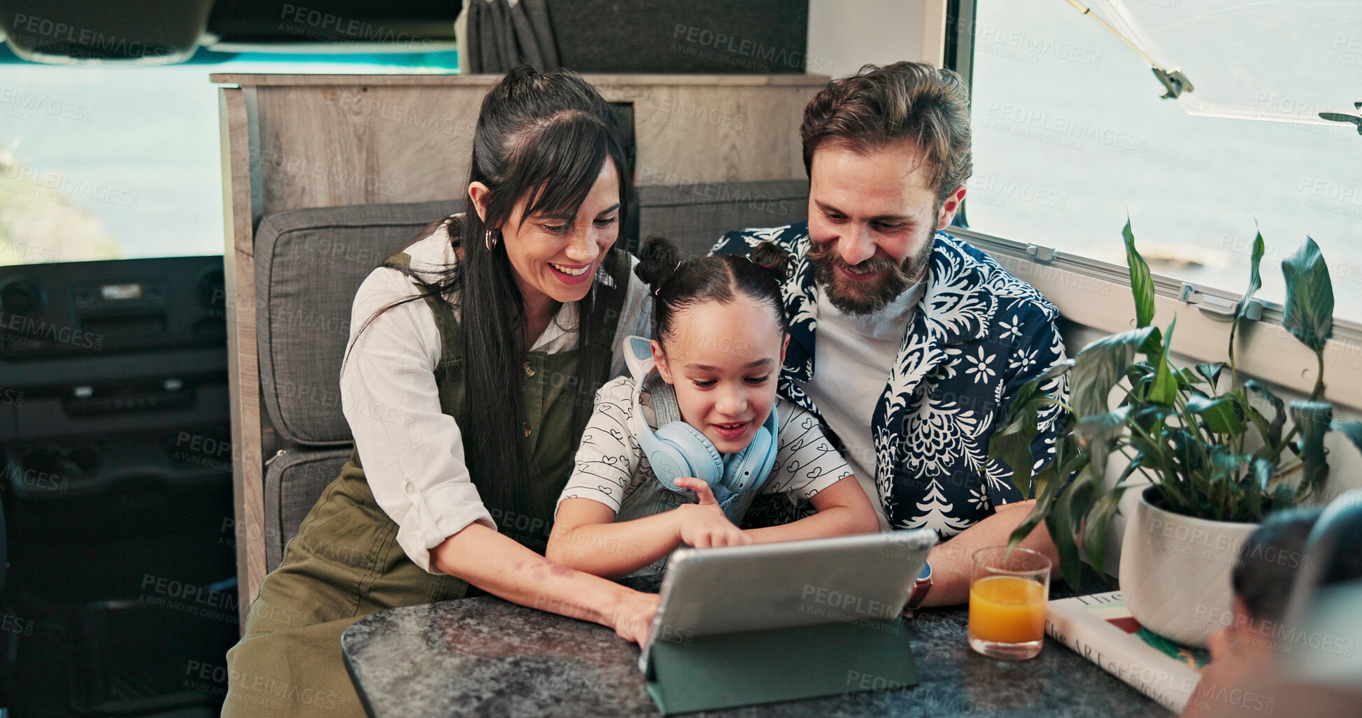 Buy stock photo Tablet, parents and child in camper van for nomad living, travel and bonding in mobile home. Family, online and vehicle with mom, dad and girl on tech for videos, movies and relax on trip or journey 