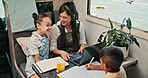 Laptop, mom and children in camper van for nomad living, travel and homework in mobile home. Family, homeschool and mother with kids in vehicle for online learning, videos and education on trip