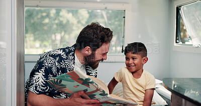 Buy stock photo Father, boy or reading book in caravan for vacation, interracial family or story for knowledge development. Travel, happy man or child with literature for language skills, bonding or learn on holiday