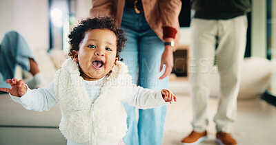 Buy stock photo Parents, walking or baby with portrait in house, child development or excited for motor skills practice. Family, infant or happy girl with learning balance in lounge, first steps or milestone support
