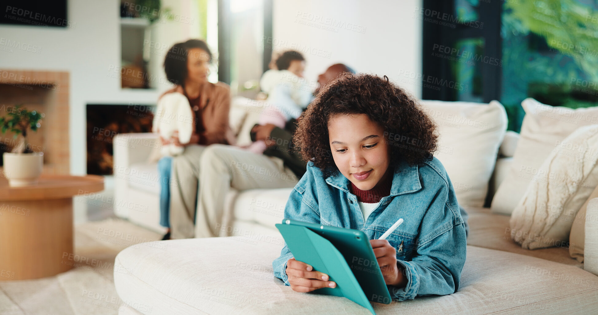 Buy stock photo Child, relax and writing with tablet at house for research, reading ebook and education video. Parents, daughter and digital for elearning, browsing website and academic games for knowledge in lounge