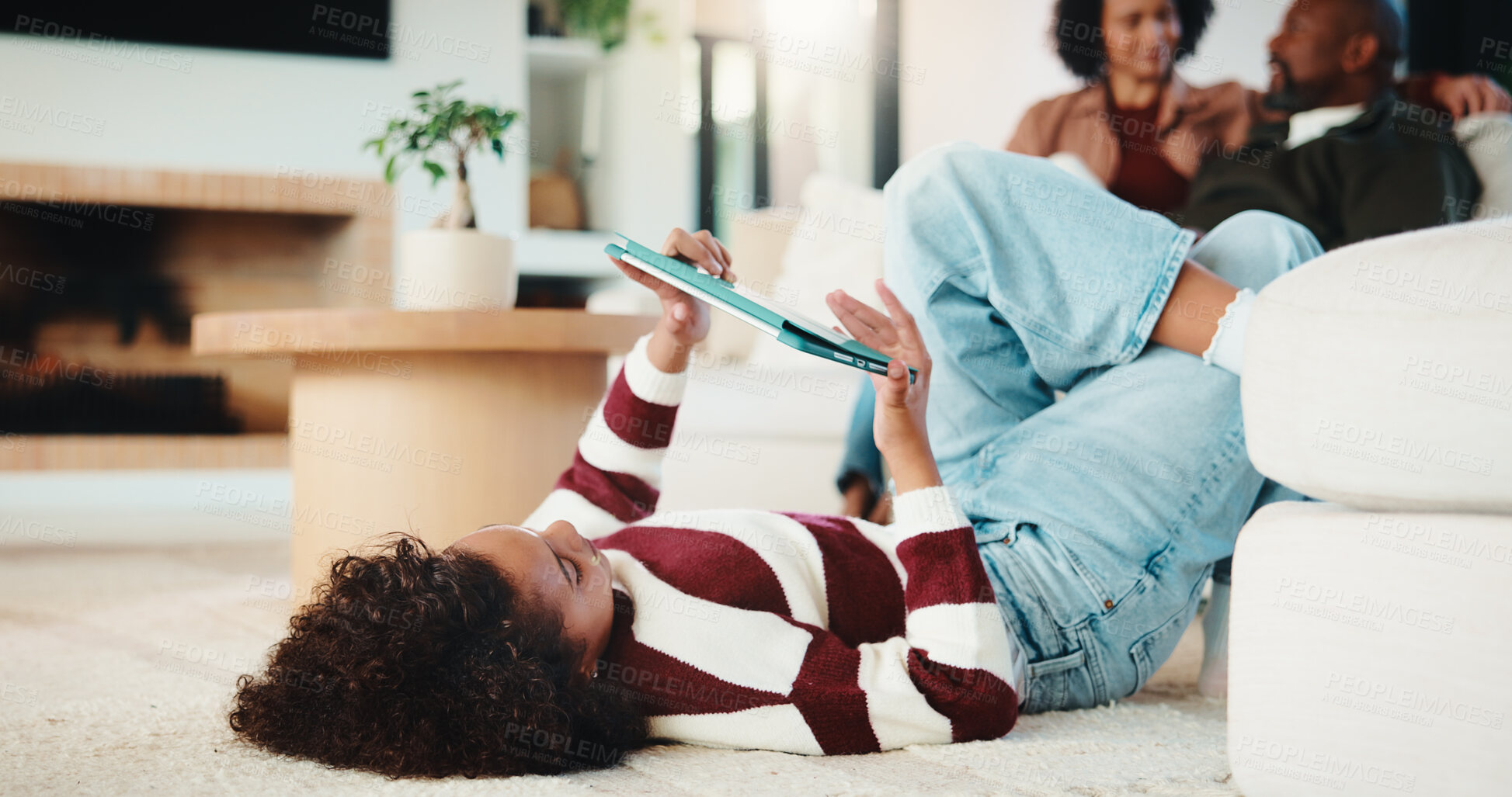 Buy stock photo Child, relax and carpet with tablet at house for research, reading ebook and education video. Parents, daughter and digital for elearning, browsing website and academic games for knowledge in lounge