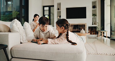 Buy stock photo Family, sharing and tablet with children on sofa in living room of home for learning or online gaming. App, development and relax with sibling kids in apartment together for education or streaming