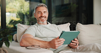 Buy stock photo Portrait, smile and tablet for remote work with man on sofa in home living room as freelancer. App, planning and research with mature person in apartment for report or review as happy wfh employee