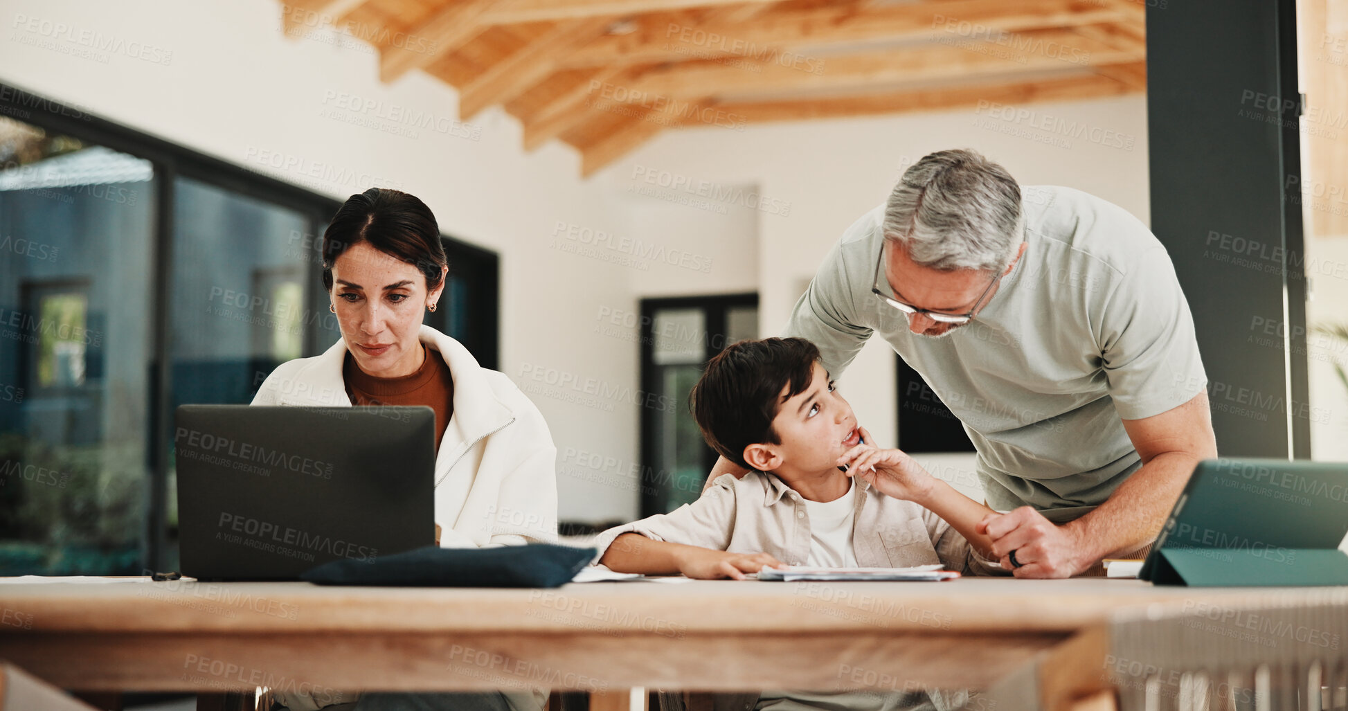 Buy stock photo Education, family and remote work parents with son in home for business or homework task. Laptop, learning and writing with child, mother and father at apartment table for freelance or study