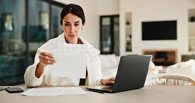 Buy stock photo Woman, reading and document with laptop at house for research, finance report and budget income. Mature person, invoice and pc for loan application, financial audit and payment for household expenses