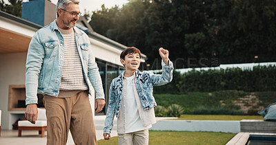 Buy stock photo Father, new home and kid outdoor, success and single parent bonding with son for victory. Backyard, dad and boy with celebration gesture for property investment, excited and real estate achievement