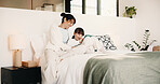 Mother, child and laugh in bedroom with tablet, streaming funny show and bonding together on weekend. Happy family, mom and daughter in home with tech, online entertainment and joke for kids cartoon.