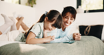 Buy stock photo Mother, daughter and relax on bed with tablet, digital app and play knowledge game for development. Happy family, mom and child learning in home with tech, website and educational gaming for growth.