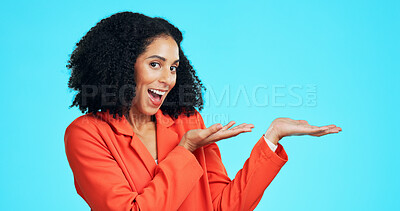 Buy stock photo Portrait, business and woman in studio for presentation, advertising launch and job info. Excited, employee and mockup space with icon, corporate hiring and onboarding offer on blue background