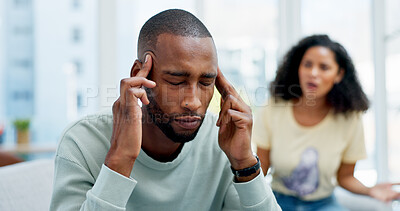 Buy stock photo Argument, headache and man on sofa in home with infidelity, cheating or toxic marriage with divorce. Stress, couple and male person with pain in living room for disagreement with breakup in house.