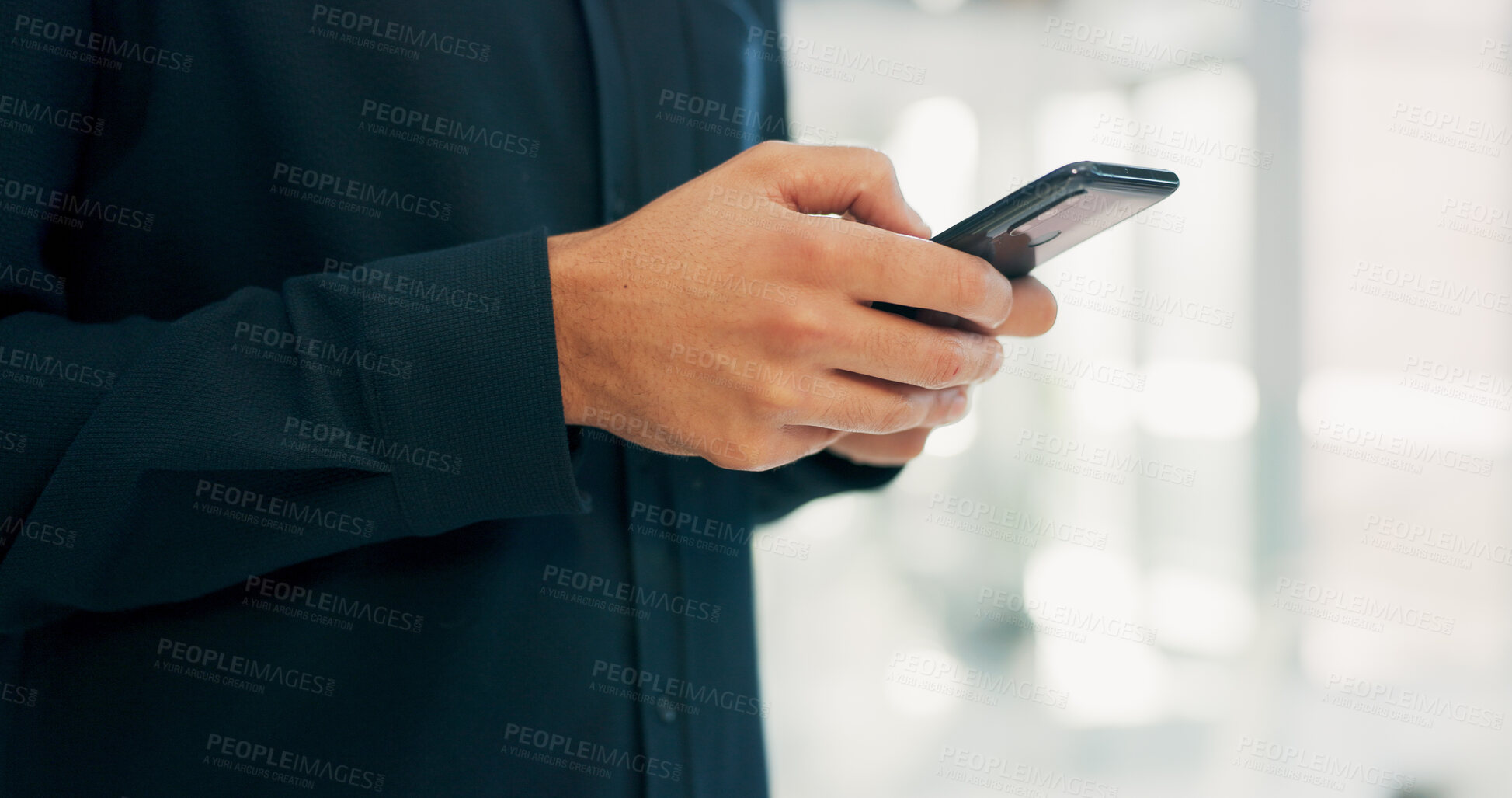 Buy stock photo Businessman, hands and texting with phone in office for conversation, social media or schedule. Man, employee or scrolling on smartphone for mobile network app, connection or online chat in workplace