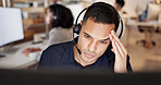 Man, headset and headache with computer at call center, stress and burnout at insurance company. Person, broker and consultant with voip, frustrated or customer service at risk management agency