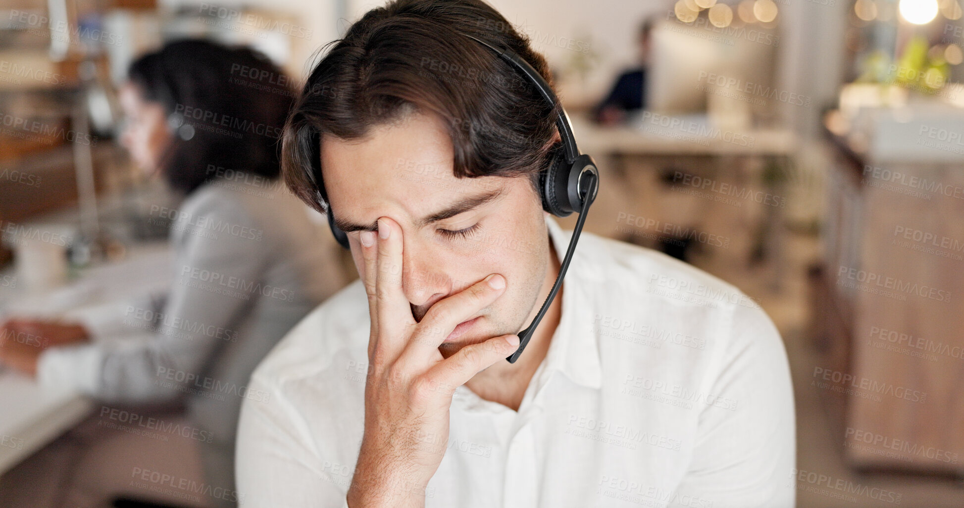 Buy stock photo Headache, man and call center consultant in office with fatigue, exhaustion or burnout for help desk. Headset, migraine and male technical support agent with stress for customer service in workplace.