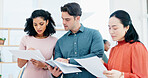 Documents, meeting and reading with team for business strategy, briefing or schedule in office. Group, employees or creative people with paperwork for project agenda, task delegation or brainstorming