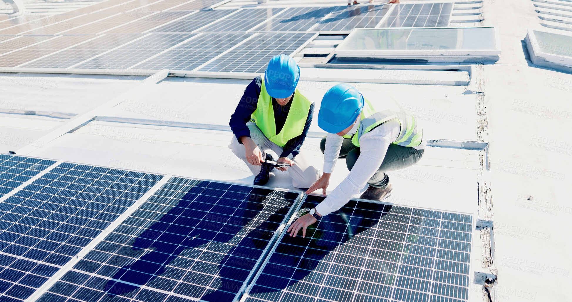 Buy stock photo Men, engineer and team for solar panel with tablet on roof, discussion or inspection with installation. People, technician and architect with tech, application or sustainability with renewable energy