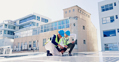 Buy stock photo Men, engineer and team for solar energy with tablet on roof, discussion or inspection with installation. People, technician and architect with tech, app or sustainability with renewable electricity