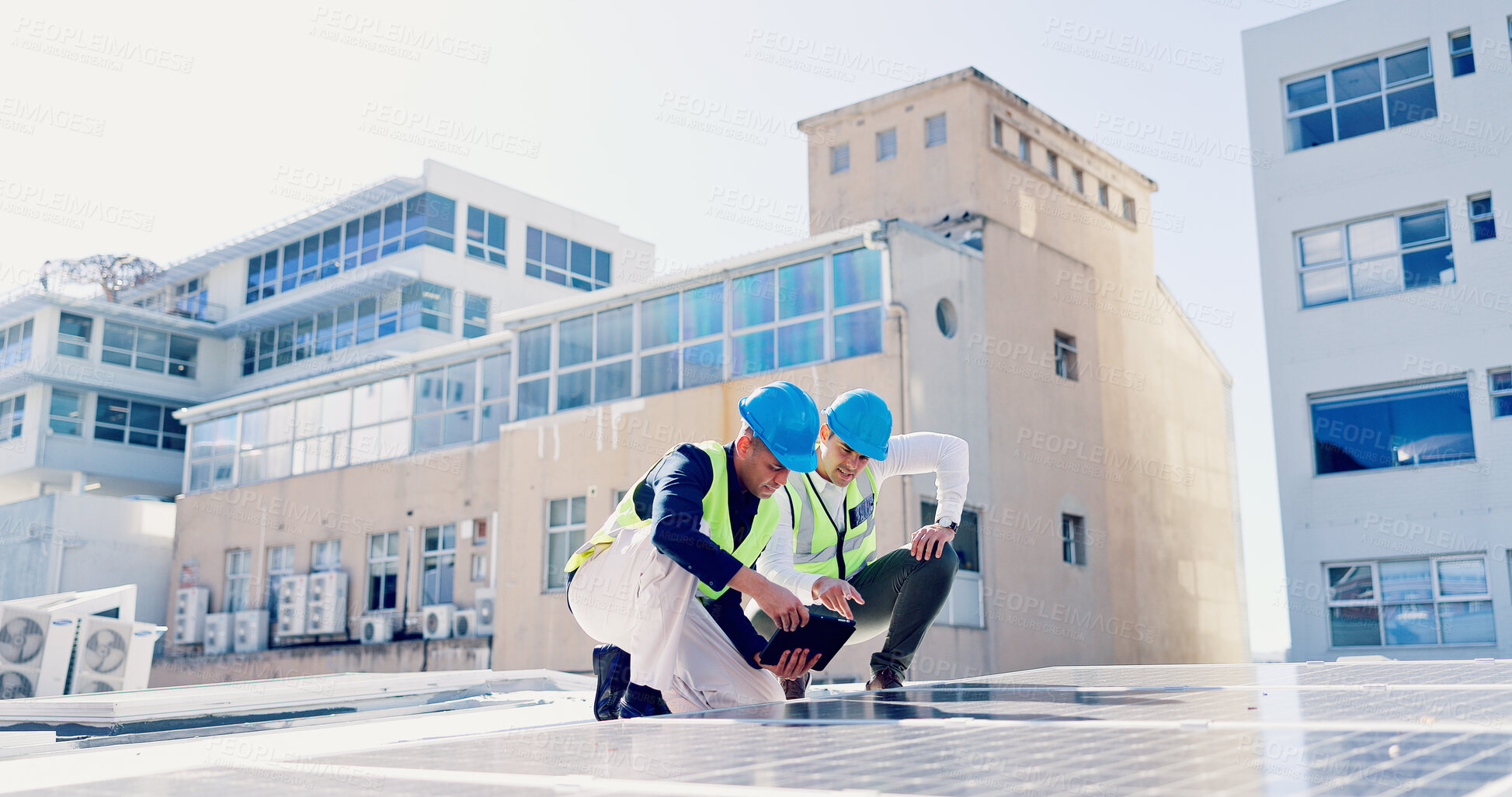 Buy stock photo Men, engineer and team for solar energy with tablet on roof, discussion or inspection with installation. People, technician and architect with tech, app or sustainability with renewable electricity