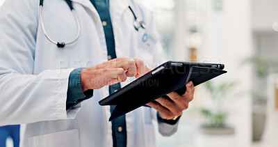 Buy stock photo Doctor, man and hands in hospital with tablet, scroll telehealth app and check schedule for appointment. Healthcare worker, person and typing in clinic with tech, medical research or online calendar.