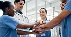 Medical, team and hands together in hospital with collaboration, connection or group synergy for goals. Happy, healthcare worker and people in clinic with stack, solidarity and cooperation for job.
