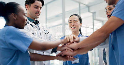 Buy stock photo Medical, team and hands together in hospital with collaboration, connection or group synergy for goals. Happy, healthcare worker and people in clinic with stack, solidarity and cooperation for job.