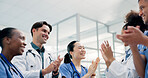 Doctors, nurses and applause in hospital for healthcare, medical achievement and team support. People, cardiology department and clapping in clinic for collaboration, surgery success and announcement