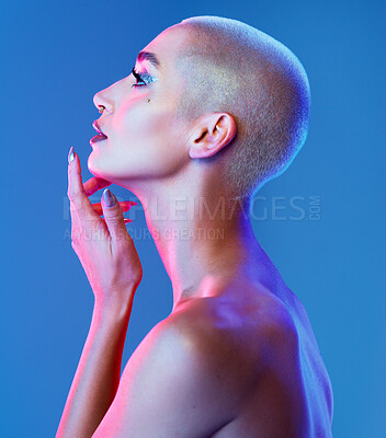 Buy stock photo Beauty, thinking or woman with cosmetics in studio, artistic expression or reflection for edgy aesthetic. Profile, bold makeup and person with creative vision, metallic trend and blue background