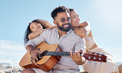 Buy stock photo Smile, summer or friends at beach with acoustic guitar, bonding or fun entertainment on weekend break. Happy, sunshine or people with music instrument, playing song or connection in outdoor getaway.